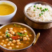 Chana Masala · Vegan. Garbanzo beans slowly cooked with onions, tomatoes, ginger, garlic and Himalayan spic...
