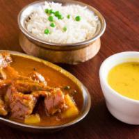 Lamb Vindaloo · Cubes of boneless lamb and potatoes cooked in our chef ’s special Himalayan tangy vindaloo s...