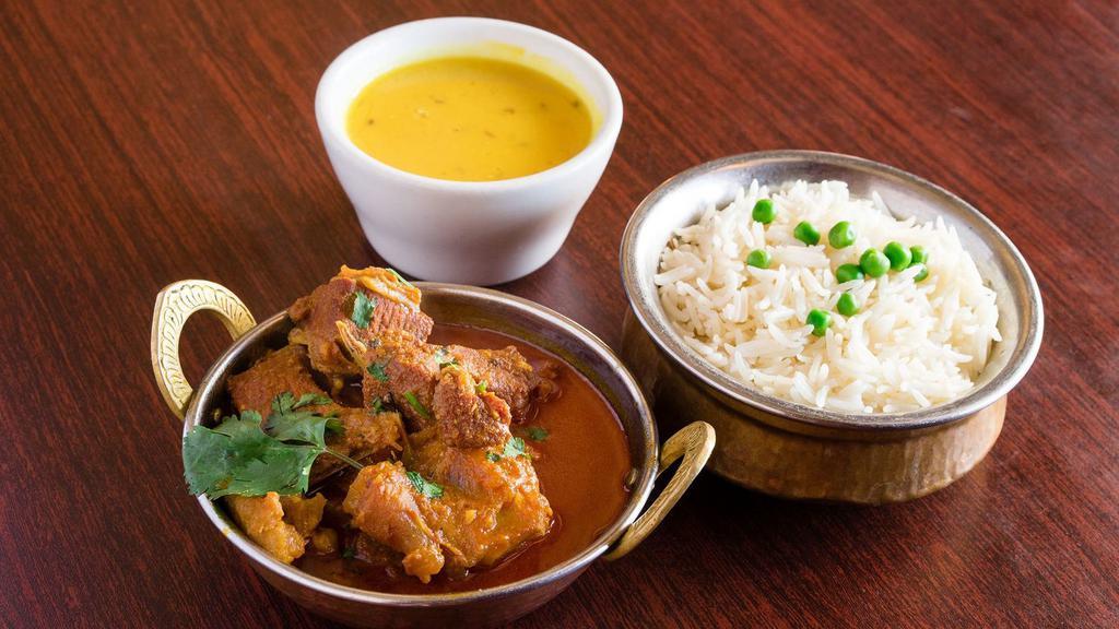 Goat Curry · Bone-in goat meat cooked in authentic Nepalese style in house special sauce, herbs, and spices.