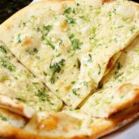 Garlic Naan · White flour bread with finely chopped garlic and coriander leaves.