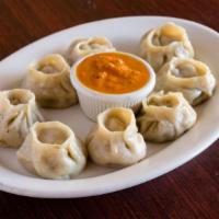 Chicken Momo · Steamed dumpling filled with minced chicken, onion garlic ginger paste cilantro, Nepalese he...