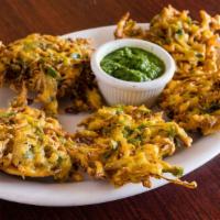 Vegetable Pakora · Vegan. Assorted vegetable fritters served with mint and tamarind chutney.