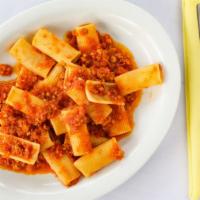 Rigatoni al Sugo di Carne · Stippled tube pasta with homemade meat sauce.