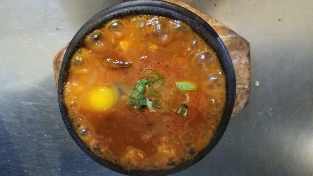 Tofu Soup · Spicy soup made with soft tofu and vegetables. Served with rice. Vegetarian.