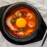 Tofu Soup · Spicy soup made with soft tofu and seafood. Served with rice.