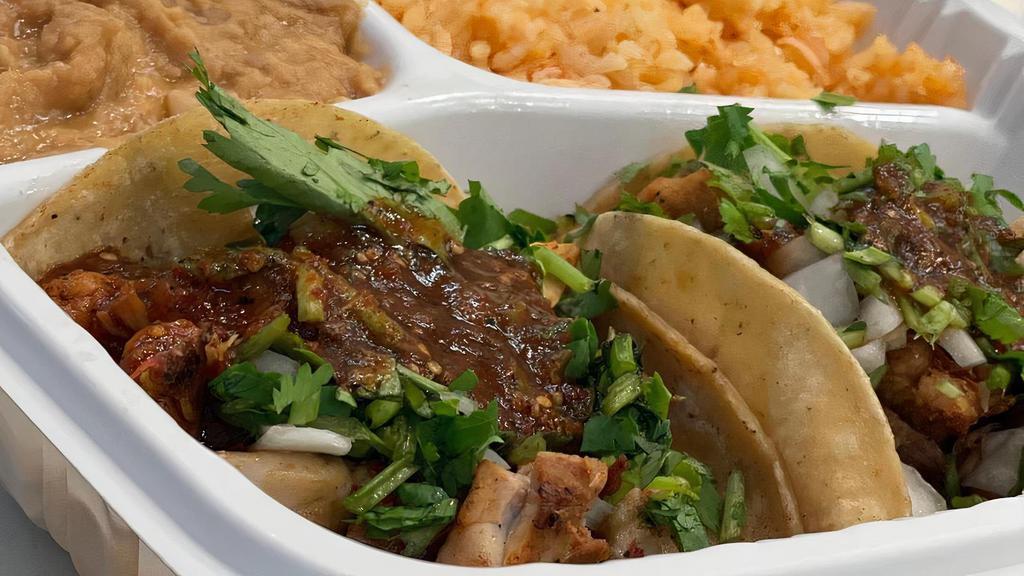 Taco Plate · Two taco's with choice of meat, onions, cilantro, hot salsa, served with choice of beans and rice, with chips & salsa