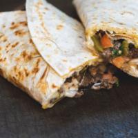 Vegan Protein Quesadilla Suiza · Choice of Protein and vegan cheese, served with chips & salsa