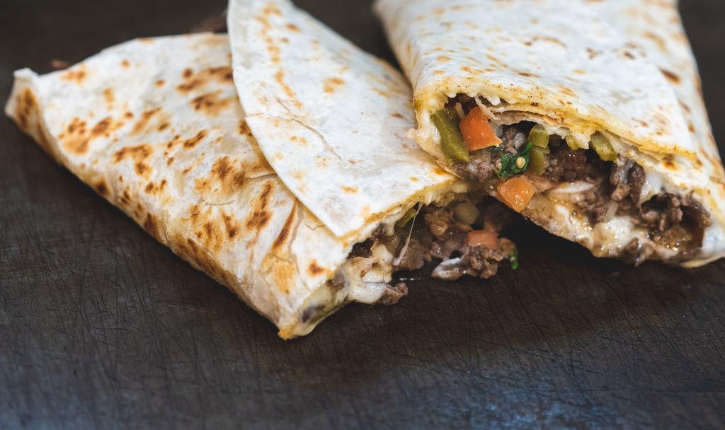 Quesadilla Suiza · Choice of meat and cheese.