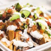 Super Nachos · Choice of meat, beans, cheese, sour cream, avocado, & pico de gallo, served with chips & salsa