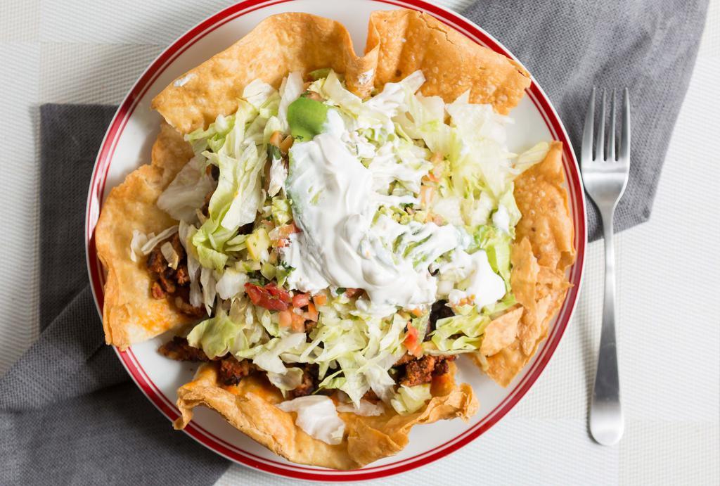 Taco Salad · Hardshell flour tortilla. Choice of meat, beans, rice, cheese, lettuce, sour cream, avocado, pico de gallo.