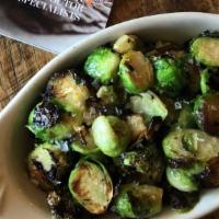 Wood Roasted Brussels Sprouts · Brussels Spouts roasted in our wood oven with lemon vinaigrette, sea salt & lemon zest