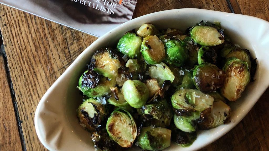 Wood Roasted Brussels Sprouts · Brussels Spouts roasted in our wood oven with lemon vinaigrette, sea salt & lemon zest