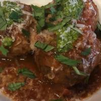 Meatballs · pork & ricotta meatballs braised in red wine & tomato, garden pesto