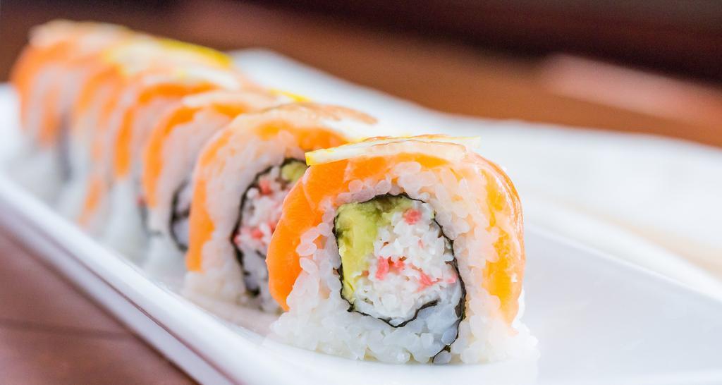 49er Roll · crabmeat and avocado topped with salmon and sliced lemons