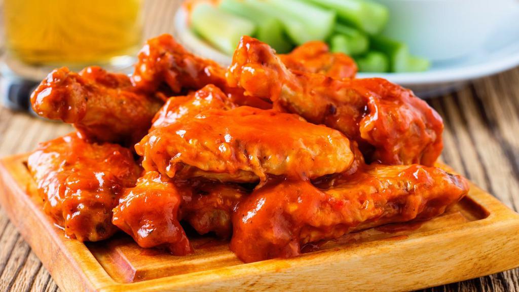 Buffalo Chicken Wings · Chicken wings deep fried to perfection and smothered in buffalo sauce. Served with celery, carrots, and dipping sauce.