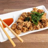 Popcorn Chicken · Fried small bite-sized boneless chicken marinated with various spices.