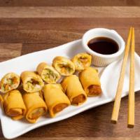 Fried Veggie Egg Rolls · Vegetarian. Wheat flour wrap filled with cabbage, carrots, green beans, mushroom, tofu and o...