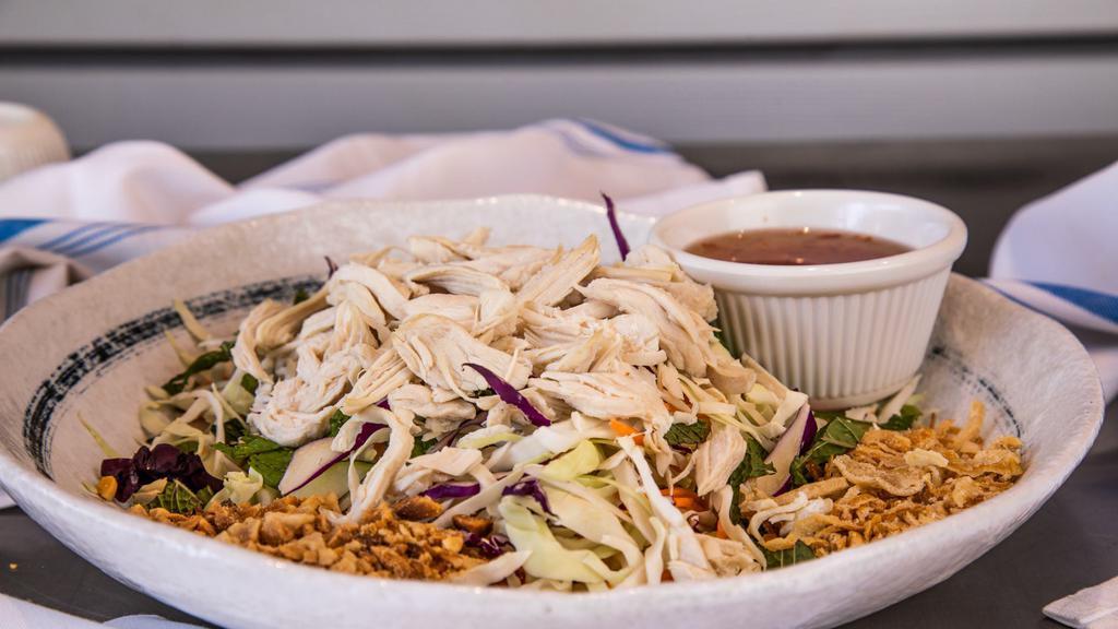 Shredded Chicken Breast Cabbage Salad · Shredded cabbage, carrots, cucumber and mint leaves, topped with peanuts and fried shallots.