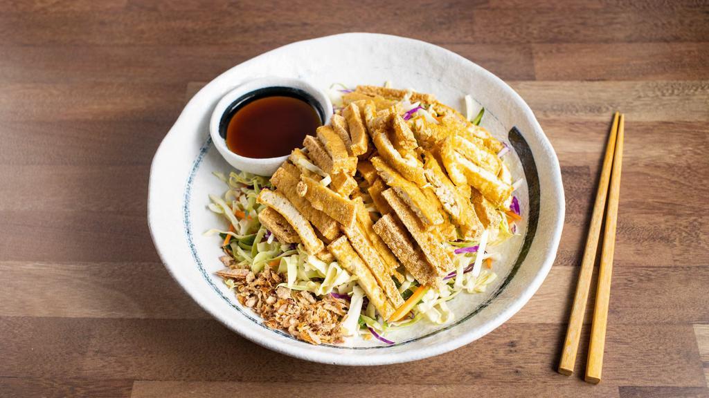 Fried Tofu Cabbage Salad   · Vegetarian. Shredded cabbage, carrots, cucumber, and mint leaves, topped with peanuts and fried shallots served with soy vinaigrette dressing.