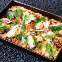 Eggplant - Zucchini Parmesan (V) · Fresh Eggplant, Zucchini, Basil, and Mozzarella Cheese, with Thinly Sliced Parmesan, with a ...