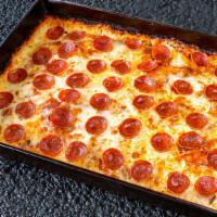 Classic Pepperoni Pizza · Pepperoni, Wisconsin Style Brick Cheese, Fresh Mozzarella, and a Hearty Red Tomato Sauce.