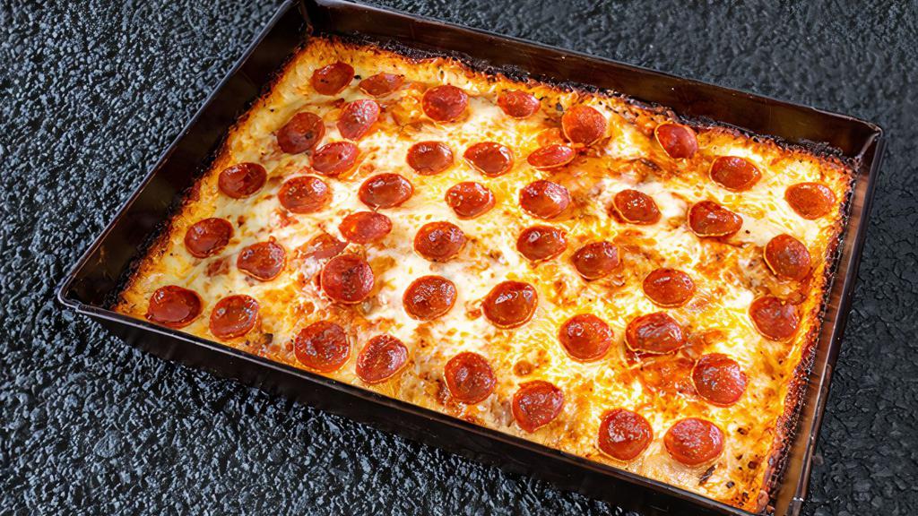Classic Pepperoni Pizza · Pepperoni, Wisconsin Style Brick Cheese, Fresh Mozzarella, and a Hearty Red Tomato Sauce.