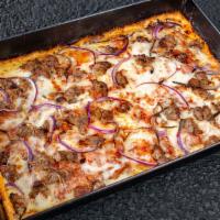 Classic Sausage Pizza · Italian Sausage, Red Onions, Wisconsin Style Brick Cheese, Fresh Mozzarella, and a Hearty Re...