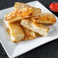 Garlic Bread · Detroit Pizza Garlic Bread with a choice of Garlic White Sauce or Hearty Red Tomato Sauce. S...