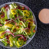 Moto Mio House Salad (V) · Romaine Hearts, Little Gem Lettuce,  Banana Peppers, Crispy Garbanzos, Oil Cured Tomatoes, B...