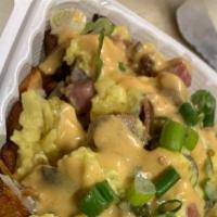 Loaded Breakfast Potatoes · Breakfast potatoes topped with shredded jack & cheddar, Black Forest Ham, Applewood Smoked B...