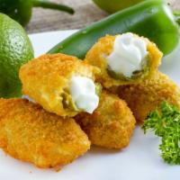 Jalapeno Poppers · Crispy deep fried jalapeno poppers made with warm cream cheese.