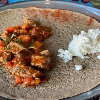 Chicken Juicy Tibs (CJT) · Marinated cubed chicken breast, onion, tomatoes, garlic, ginger, berbere, butter, and jalape...