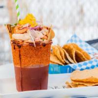 Marinera · Michelada (your chaise of beer) with clamato, lime juice, sauces, and on top of it there is ...