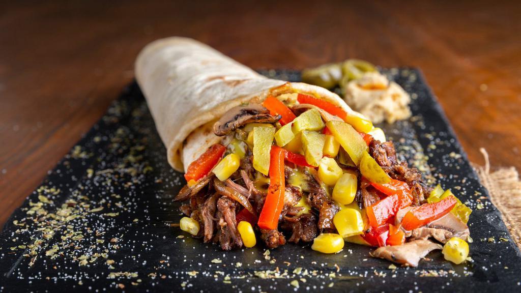 Halal Lamb & Beef Gyro Wrap · Lamash bread, lettuce, tomatoes, cucumbers, house dressing, taziki, and lamb and beef gyro.