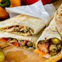 Halal Kofte Kebob Wrap · Lamash bread, lettuce, tomatoes, cucumbers, house dressing, and kofte kebob.