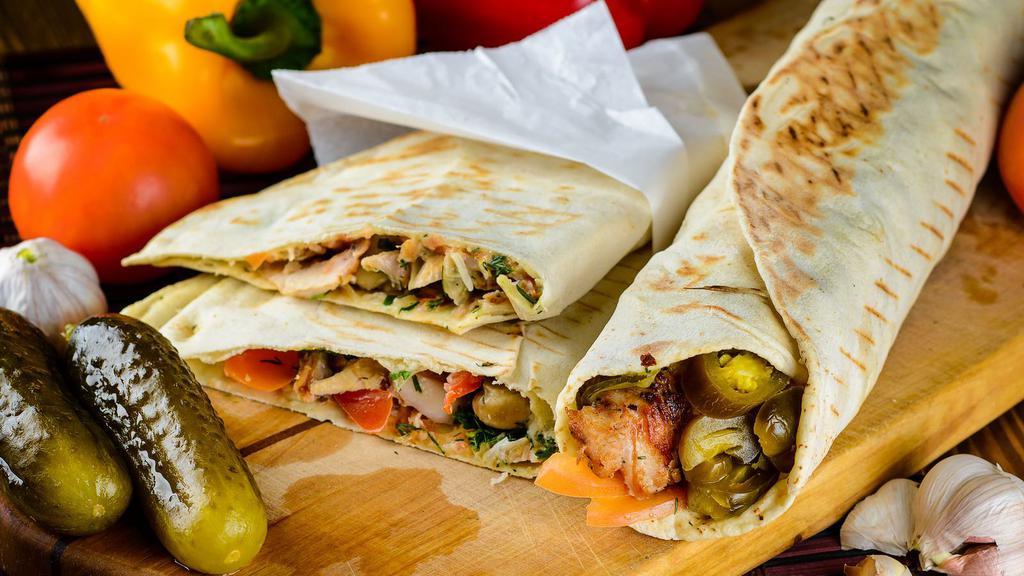 Halal Kofte Kebob Wrap · Lamash bread, lettuce, tomatoes, cucumbers, house dressing, and kofte kebob.