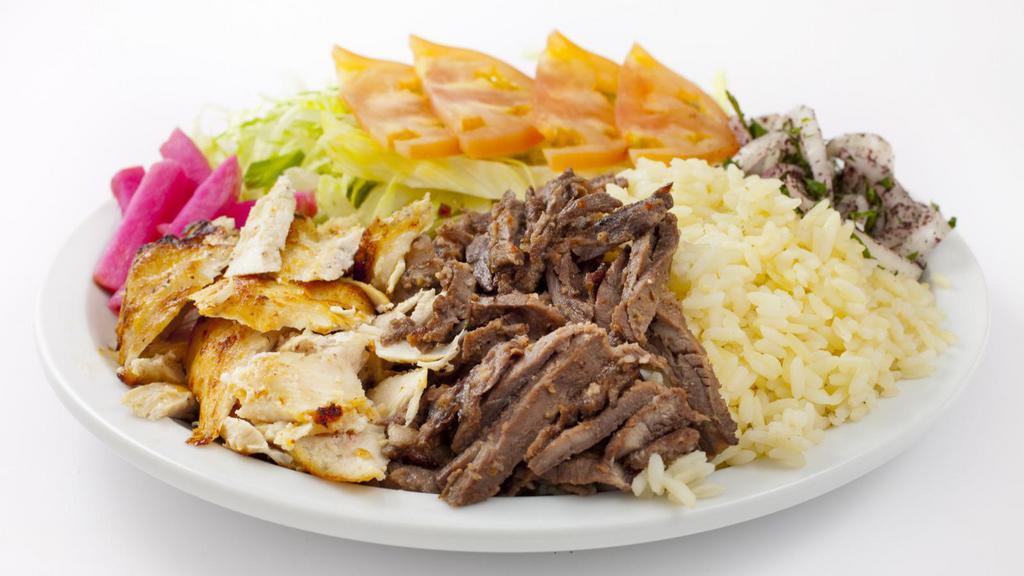 Famous Lamb Over Rice · Juicy lamb meat served with shredded lettuce, diced tomatoes, chopped onions and house made tzatziki sauce over rice.
