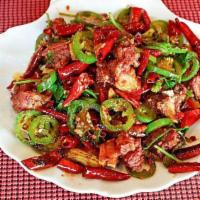 羊排 Spicy Lamb Ribs · With explosive chili peppers. Lamb riblets with explosive chili pepper and jalapeno.