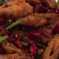 干扁肠 Dry Fried Pork Intestines · Spicy fried intestines with chili peppers.