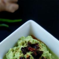 Coconut Chutney · Fresh grated coconuts ground with green chutney, ginger, lentils and herbs. 
Gluten free. Ve...