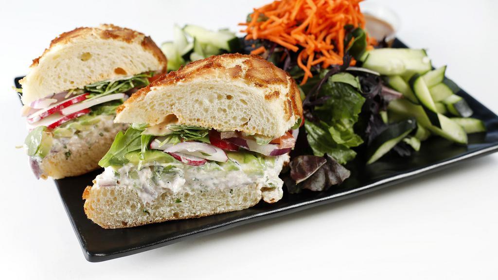 Crab Sandwich · Dutch crunch bread with homemade crab salad, radish, onion, tomato, avocado chili mayo, arugula.