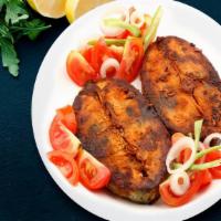 Traditional Masala Fish Fry · Fish fry is a delicious roasted fish with lemon and orange slices, spices.
