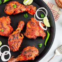 Blackned Tandoori Chicken Leg (1pc) Quarter · Tandoori chicken is a chicken dish prepared by roasting chicken marinated in yogurt and spic...