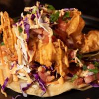 Baja Taco · Beer breaded shrimp taco, with purple and green cabbage topped with Pico de Gallo and grated...