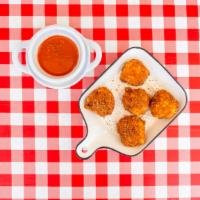 Mac Bites · Sourdough breaded fried mac & cheese balls with tangy tomato sauce