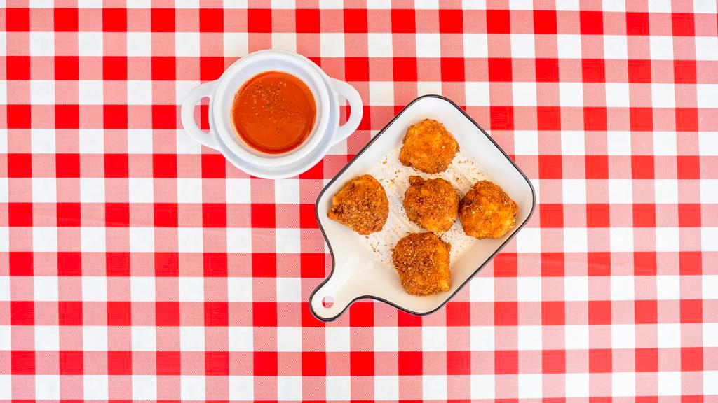 Mac Bites · Sourdough breaded fried mac & cheese balls with tangy tomato sauce