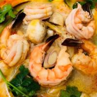 Seafood Tom Yum · Hot & spicy. Most popular Thai spicy & sour clear soup with crab, shrimp, squid, green musse...
