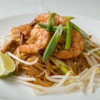 Pad Thai · Thai noodle dish with rice noodle, egg, bean sprouts, green onion, and crushed peanuts.