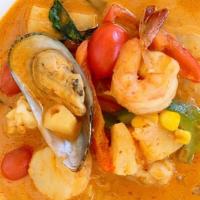 Pineapple Curry with Seafood · Shrimp, mussels, calamari, scallops, pineapple, bell pepper and Thai basil in red curry