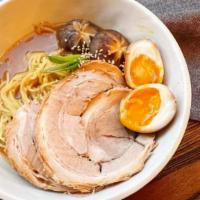 Miso Ramen  · Tender thin slices of housemade chashu, soft ramen eggs, nori and bean sprouts in a mild soy...